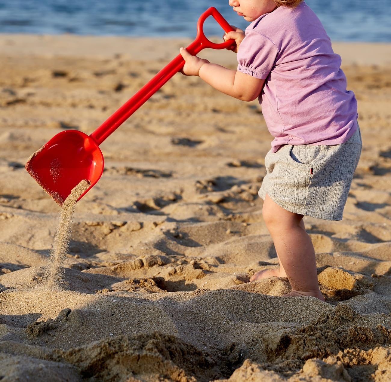 Hape Giochi da spiaggia Paletta Portentosa rossa