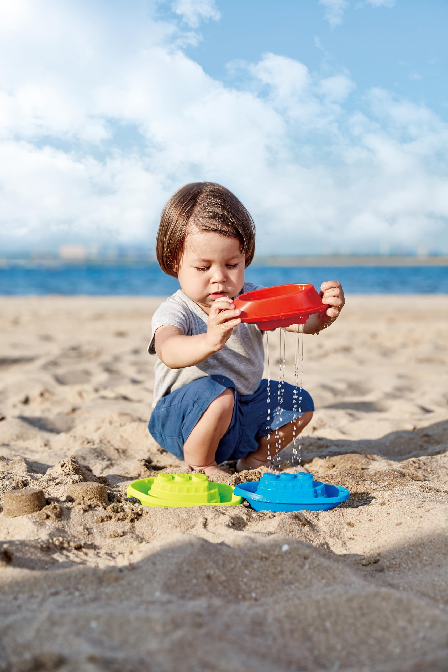 Hape Giochi da spiaggia Barchette impilabili 3 pezzi multicolore forate