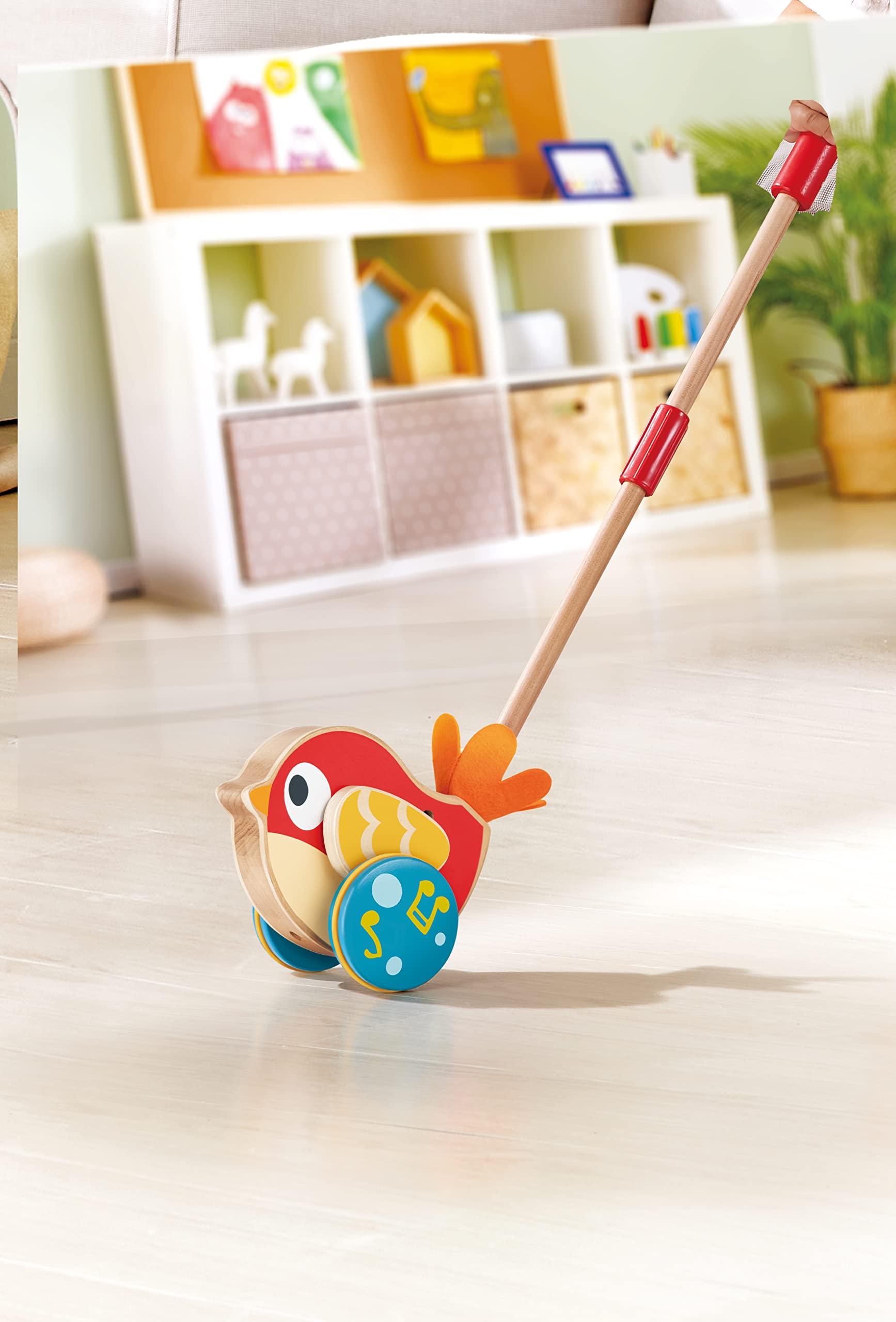 Hape Spingi e cammina Lilly uccellino musicale in legno