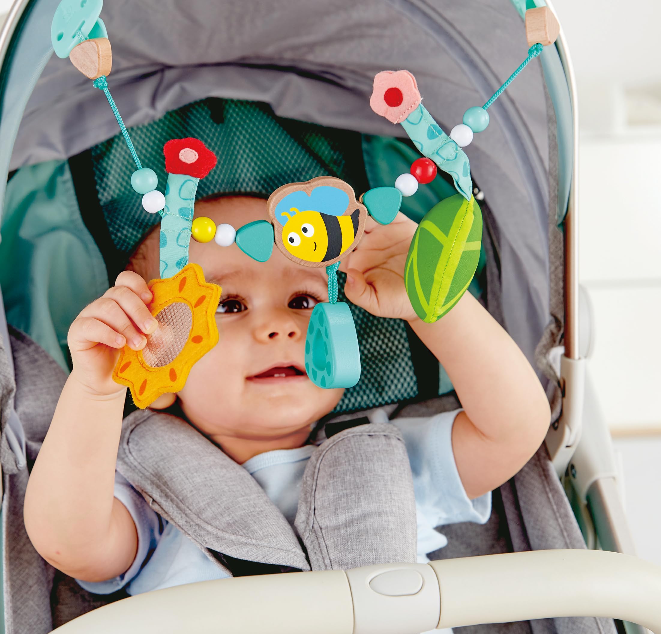 Hape Giocattoli per l'infanzia Gioco per carrozzina sonaglio ape e girasole